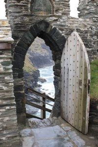 Stone archway with view of water beyond it